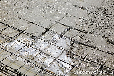 A plasterer concrete worker at floor work Stock Photo