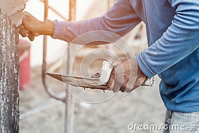 Plasterer concrete worker at wall of home Stock Photo