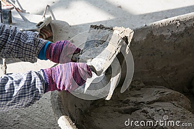 Plasterer concrete worker at wall of house construction Stock Photo