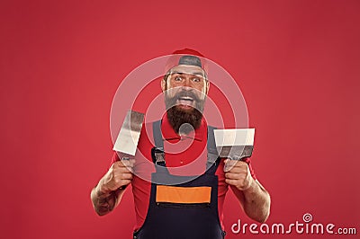 Plasterer hipster builder in cap red background. Interior designer. Professional plasterer. Skillful plasterer Stock Photo