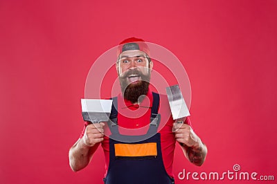 Plasterer hipster builder in cap red background. Interior designer. Professional plasterer. Skillful plasterer Stock Photo