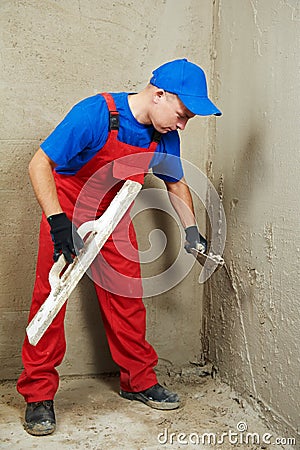 Plasterer at work Stock Photo