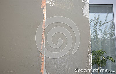 Plastering wall with fiberglass mesh, plaster mesh after rigid insulation. Stock Photo