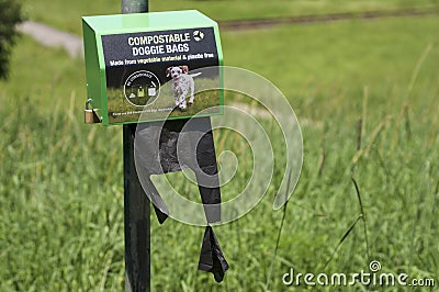 Plastic bag dispenser for dog feces Editorial Stock Photo
