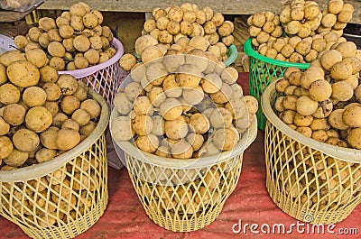 Plastic basket of southern langsat fruits Stock Photo