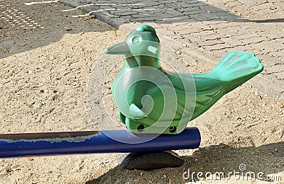 Plastic Bird Seesaw in A Kid Playground Stock Photo