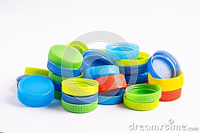 Plastic bottle colored screw caps for recycle waste on white background, container water lid Stock Photo