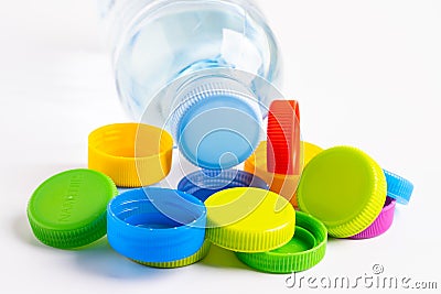 Plastic bottle colored screw caps for recycle waste on white background, container water lid Stock Photo