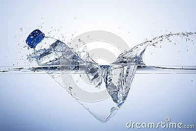 Plastic bottle dive with splash Stock Photo