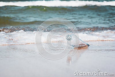 Plastic bottle in ocean water, littering the sea concept image Stock Photo