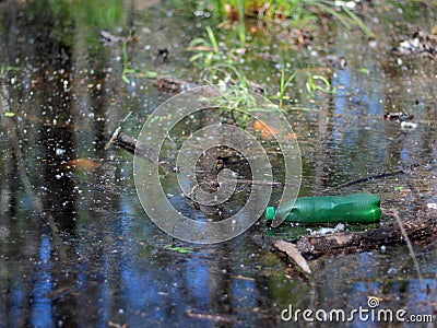 Plastic bottle in a pond Stock Photo