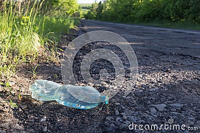 Plastic bottle with water by the road Stock Photo