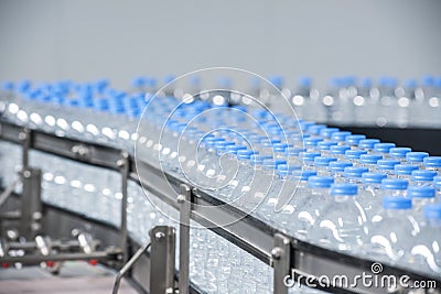 Plastic bottles on conveyor belt Stock Photo