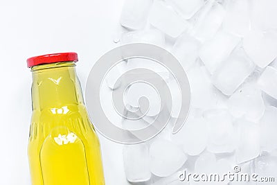 Plastic bottles with fruit juice and ice top view space for text Stock Photo