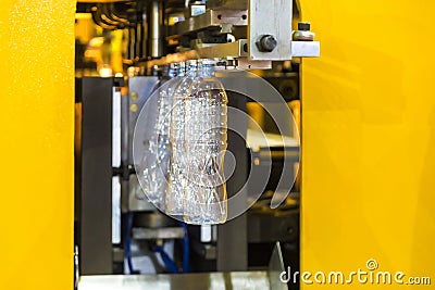 Plastic bottles ready to be filled on a bottling line of automatic PET/plastic bottle blow moulding machine Stock Photo