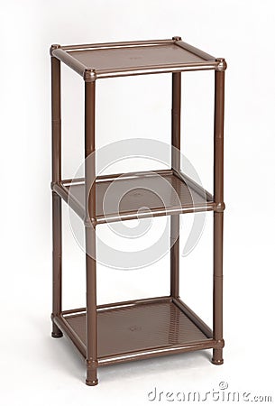Plastic collapsible furniture. A convenient shelf for things. Stock Photo