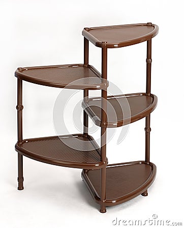 Plastic collapsible furniture. A convenient shelf for things. Stock Photo