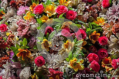 Plastic colourful flowers. Background texture Stock Photo