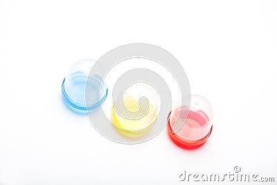 Plastic colours capsule white background Stock Photo