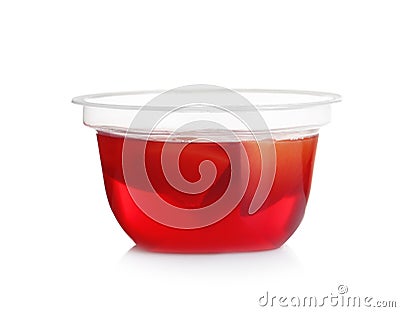 Plastic container with tasty jelly on white Stock Photo