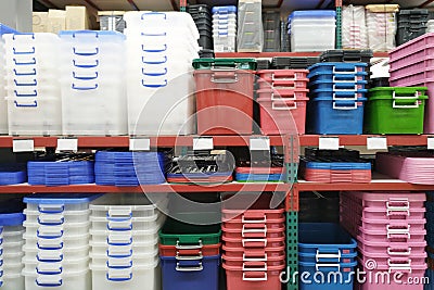 Plastic containers in houseware store.storage boxes on shelf Stock Photo