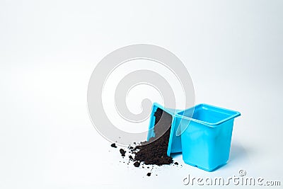 Plastic containers for planting seeds on seedlings. pots of different colors on white background. isolable Stock Photo