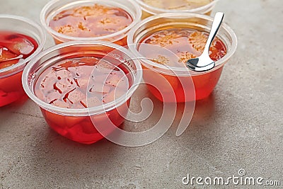 Plastic containers with tasty jelly desserts Stock Photo