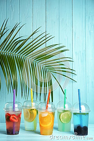 Plastic cups with lemonades on table Stock Photo