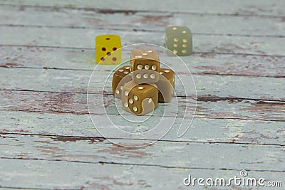 Plastic Dices on White Wooden Table: Gambling Theme Stock Photo