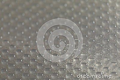 Abstract background of lots of grey pimples dots. Plastic surface with pimples Stock Photo