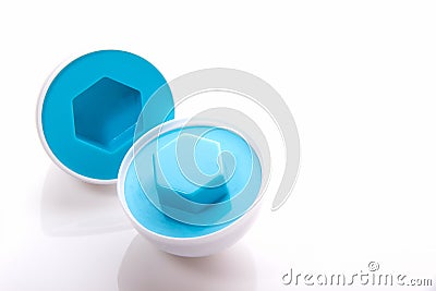 Plastic egg developmental puzzle of blue color with a hexagon sh Stock Photo