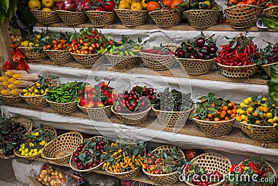 Plastic fake food - vegetables and fruits lying in baskets to st Stock Photo