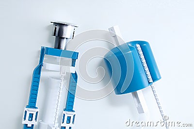 Plastic fittings for toilet bowl on a white background Stock Photo