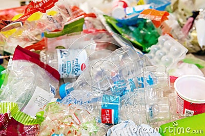 Plastic food containers that can be recycled if they are collected in the trash properly Editorial Stock Photo