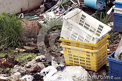 Plastic fruit Basket Crate box and Pile of Waste plastic bags, Plastic bag in water waste rotten river, Garbage moss in sewage Stock Photo