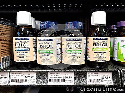 Wild Alaskan Wiley's Finest Fish Oil sign and products line store shelves Editorial Stock Photo