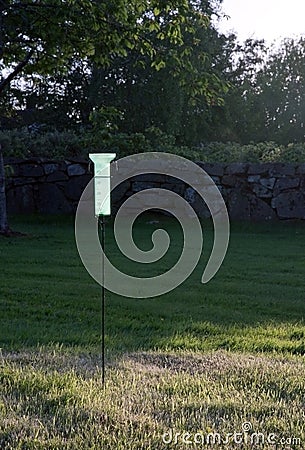 Plastic green rain-gauge Stock Photo