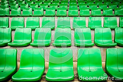 Plastic green seats on football stadium Stock Photo