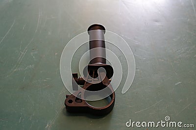 Plastic handle to hold the punch on a green background. Stock Photo