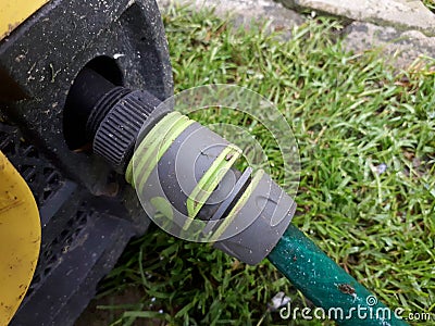 Plastic hose connector connected to a pressure Stock Photo