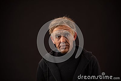 Plastic makeup. makeup for cinema. old man on a black background Stock Photo