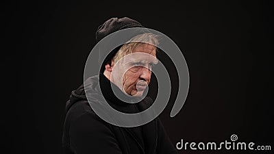Plastic makeup. makeup for cinema. old man on a black background Stock Photo