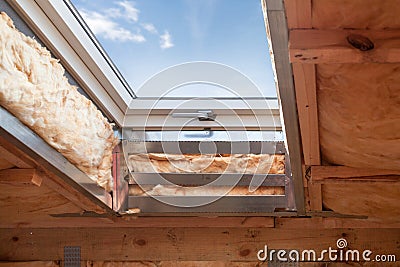 Plastic mansard or skylight window on attic with environmental Stock Photo