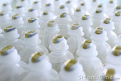 Plastic medical bottles with a liquid, rows Stock Photo