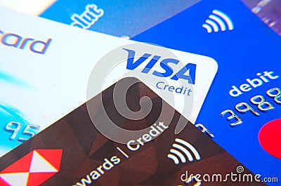 Plastic payment cards close up, selective focus. Credit and debit payment cards, macro. Business concept. Credit card close up sho Editorial Stock Photo