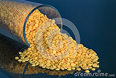 Plastic pellets, industrial beads on blue background Stock Photo