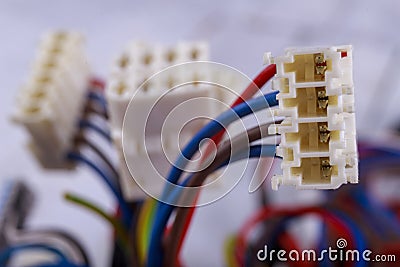 Plastic plugs mounted on electric cables. Electrical connectors for connecting devices and components. Stock Photo