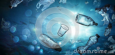 Plastic Pollution In Ocean Underwater Shine With garbage Floating Stock Photo