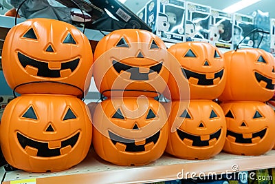 Plastic pumpkins buckets for sale in a store shelf Stock Photo