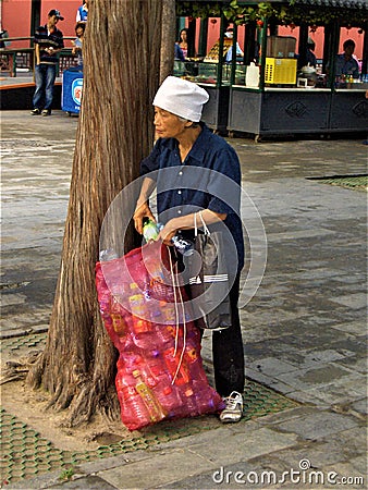 Plastic recycling and woman in China Editorial Stock Photo